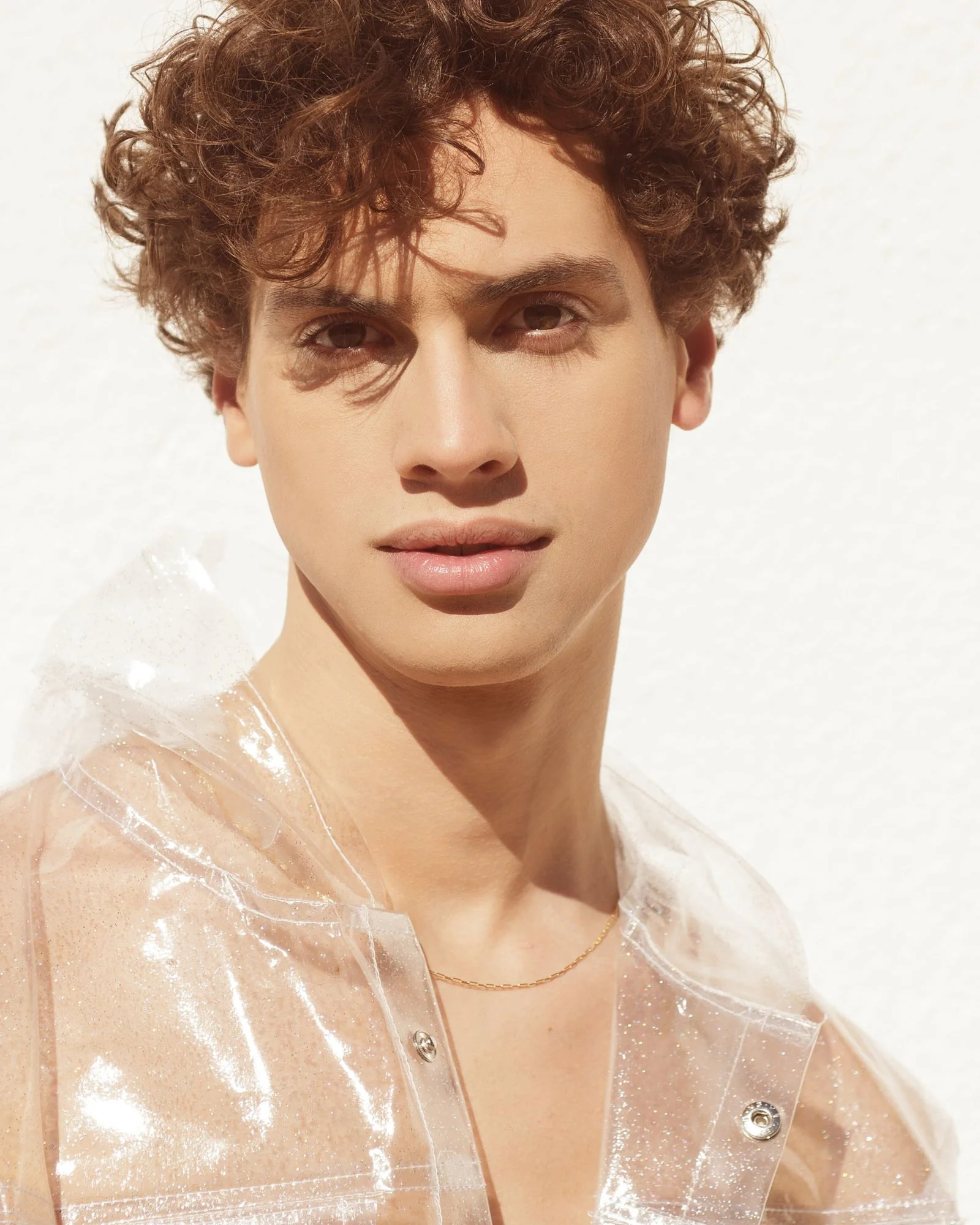 Sunlit portrait showing loose curls and natural texture