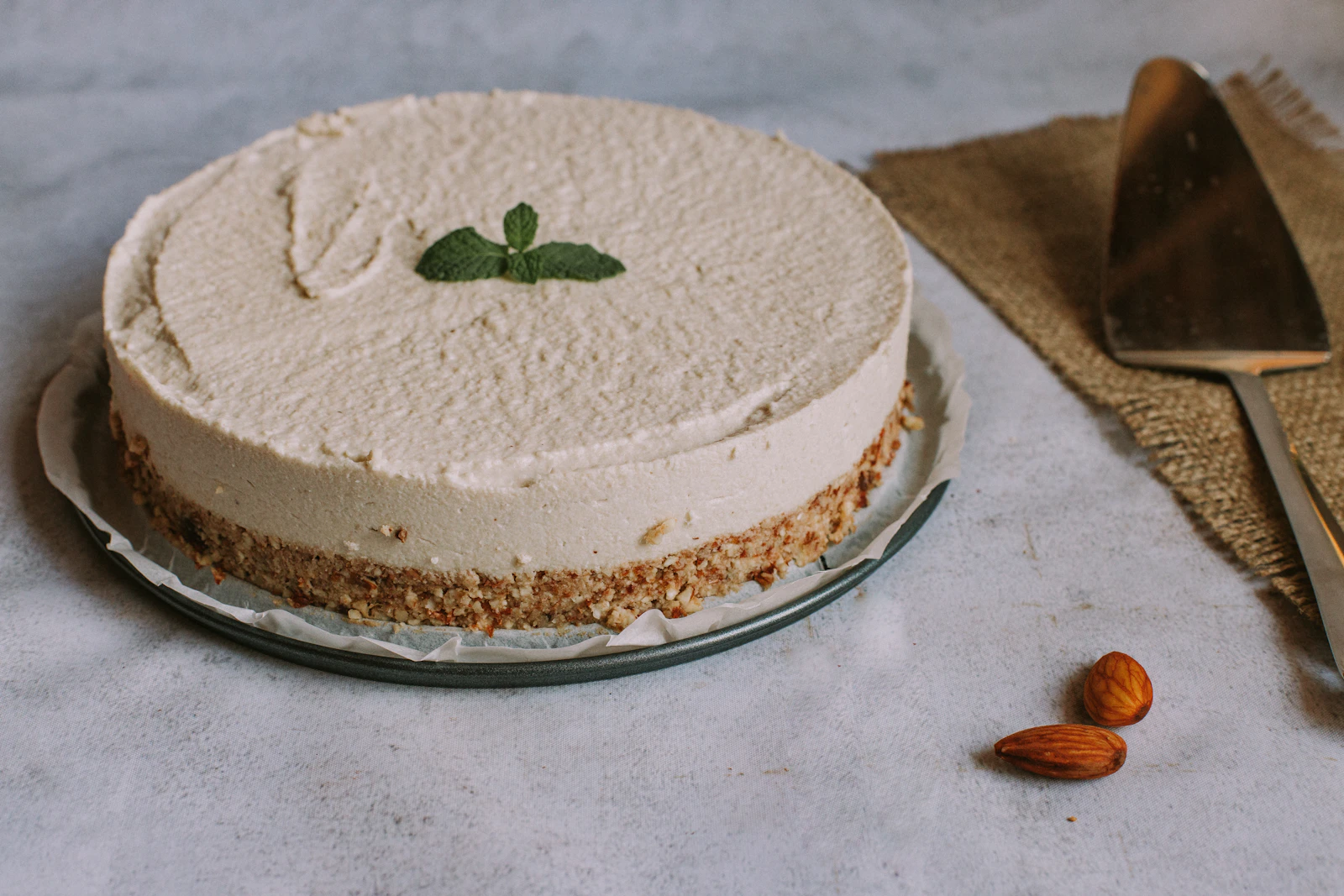 An almond-based cake finished with cream and mint