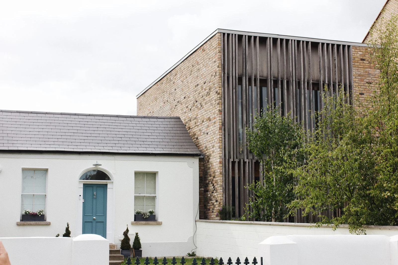 Brick residential facade with modern and traditional details