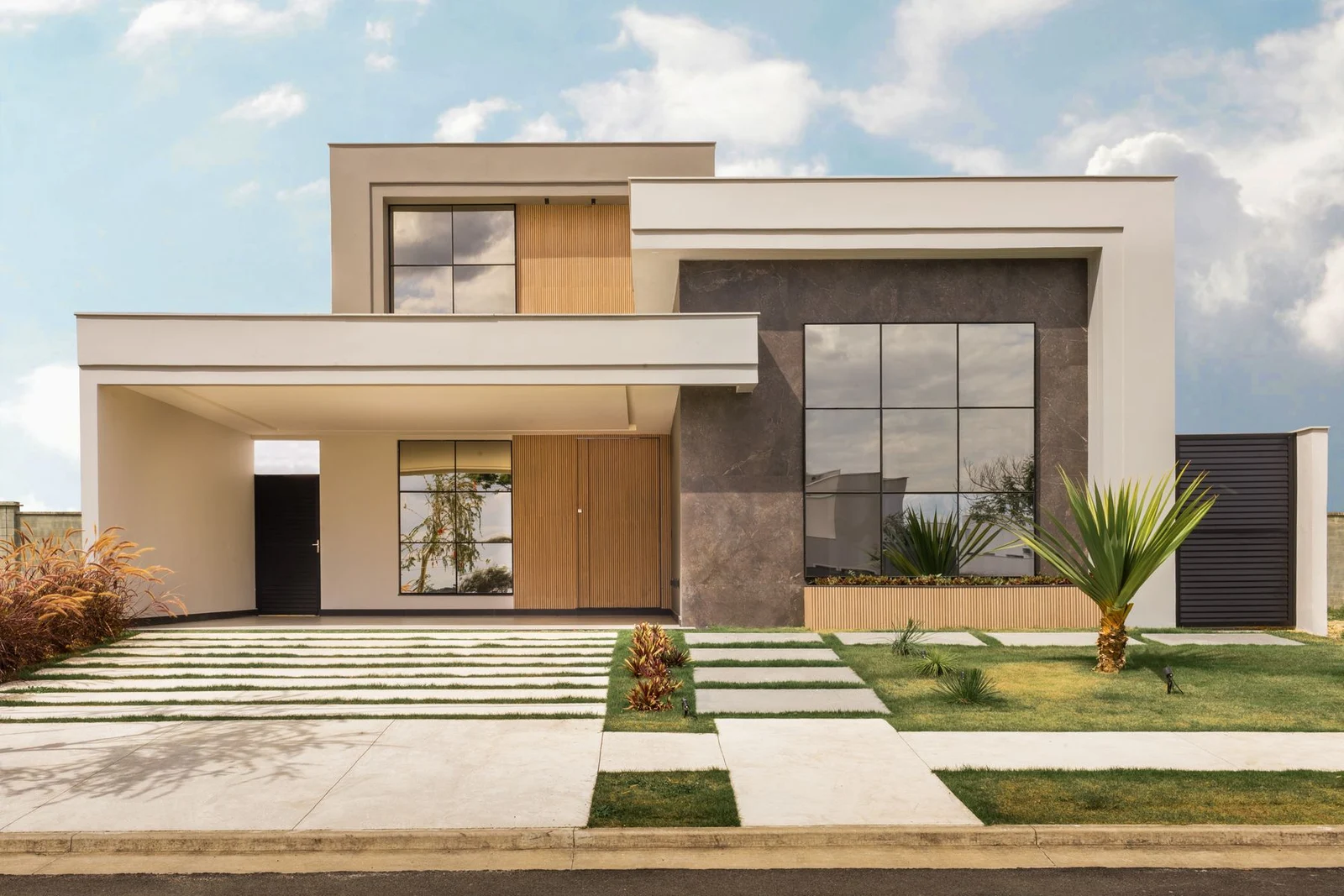 Contemporary house with large windows and landscaped frontage
