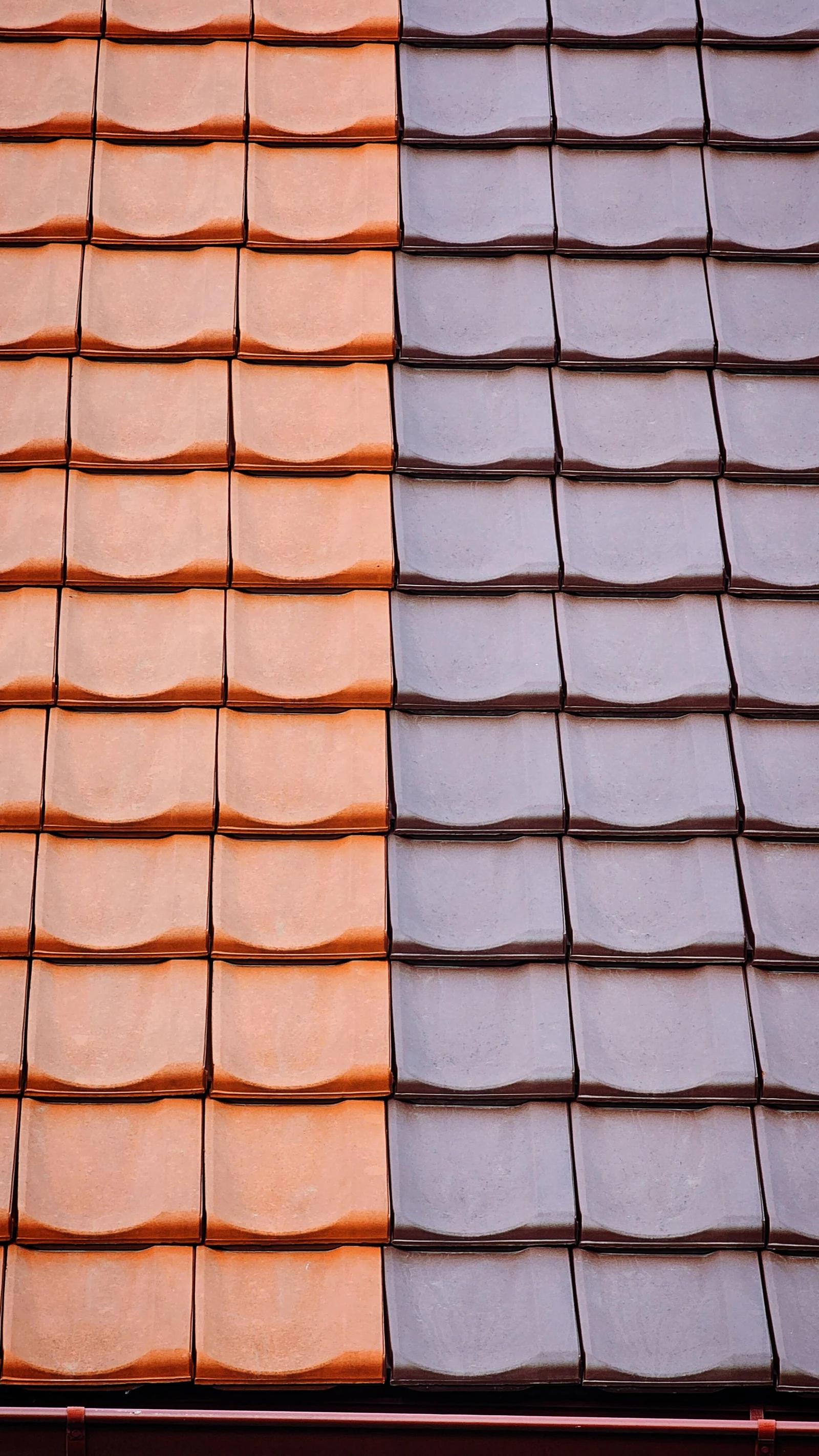 Orange and gray clay roof tiles in a geometric arrangement