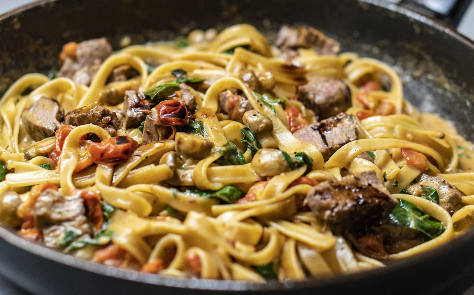 Fresh pasta with herbs and a rich sauce